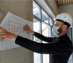 Specialty Contractors Specialty contractors checking a building plan