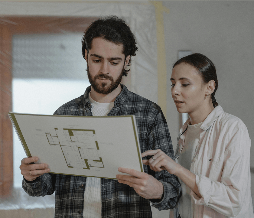 Home owners Home owners looking at their home document